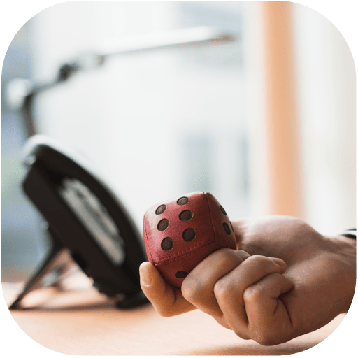 a hand holding a gambling dice representing gaming with responsibility